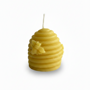 Vela que representa una colmena antigua con unas abejas